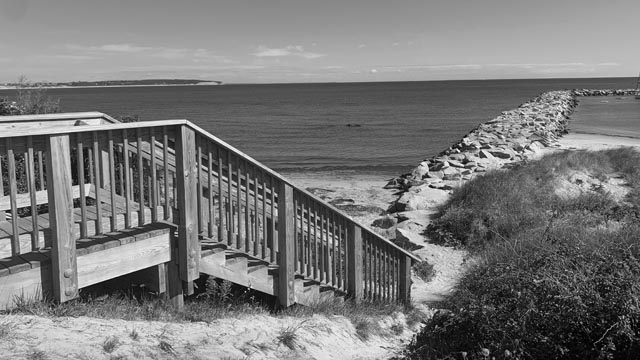 picturesque block island stairs in harbor in black and white