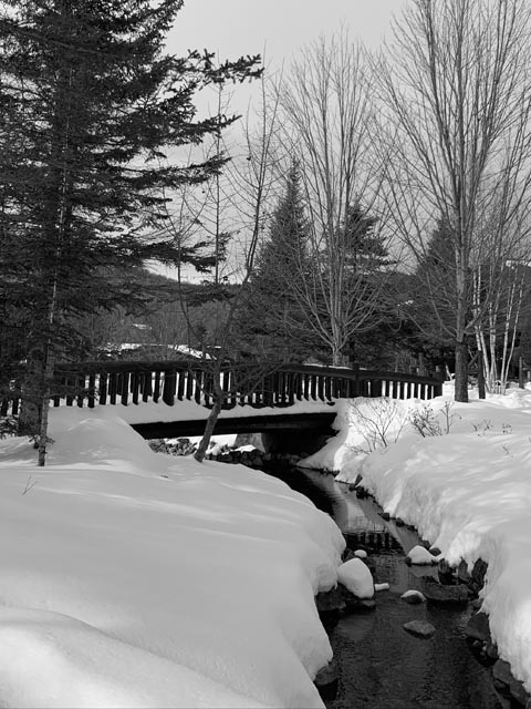 winter snow creek under bridge Lake Placid New York